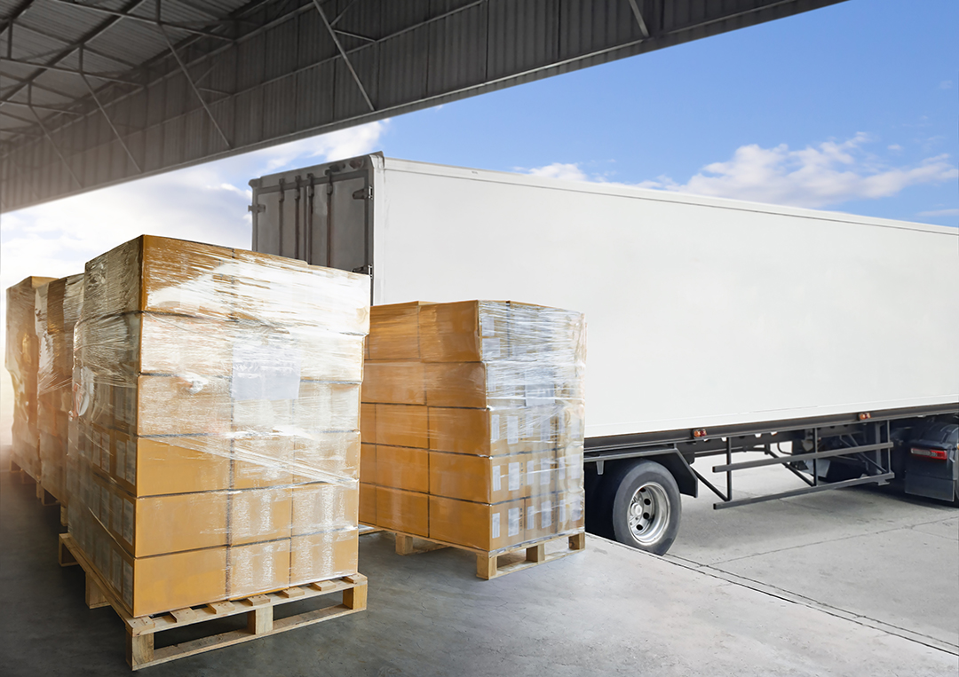 Stock photos of pallets of boxes about to be loaded on a truck